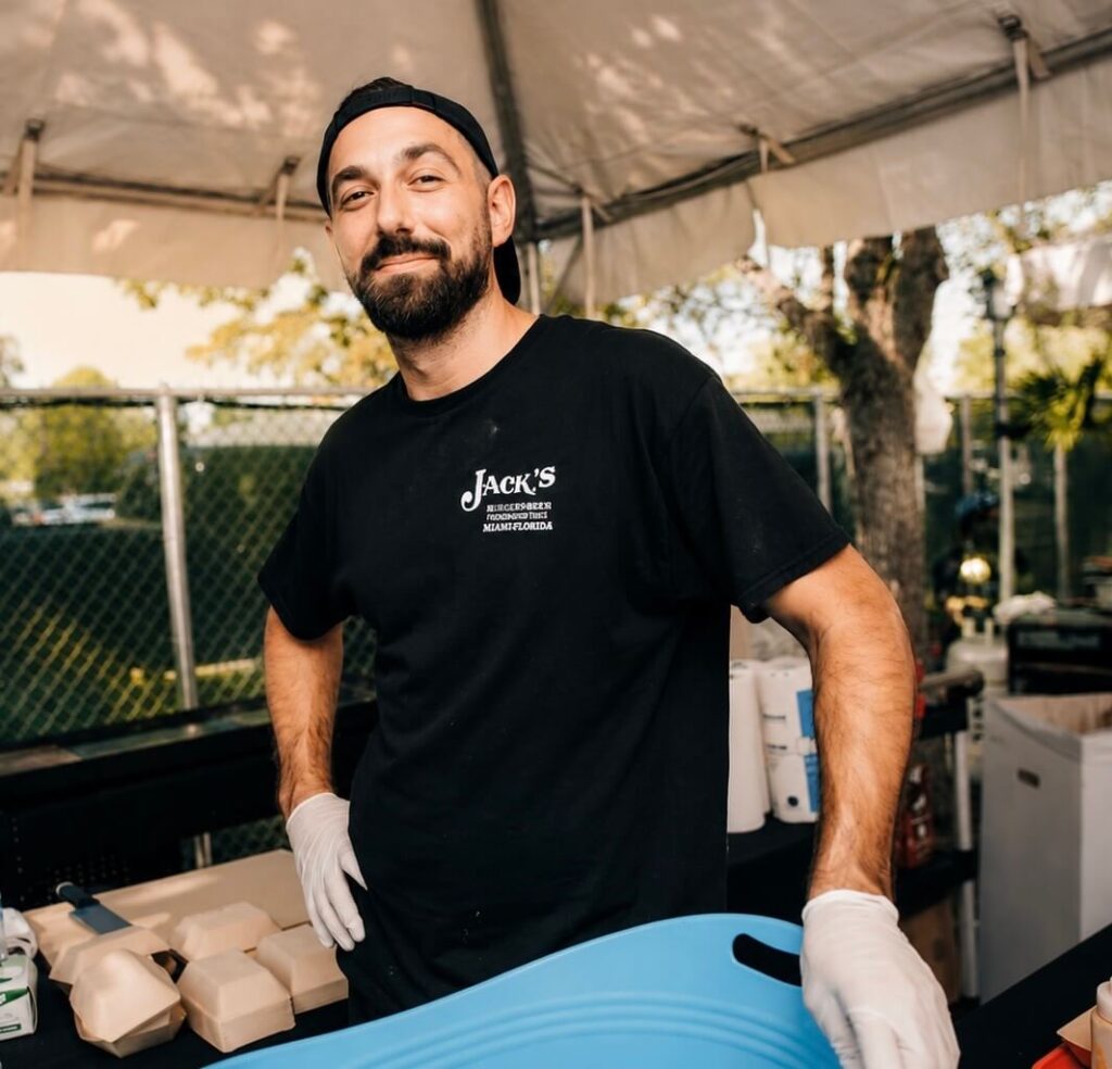 Jack's Old Fashion Hamburgers chef serving burgers at the Boca Burger Battle 2026